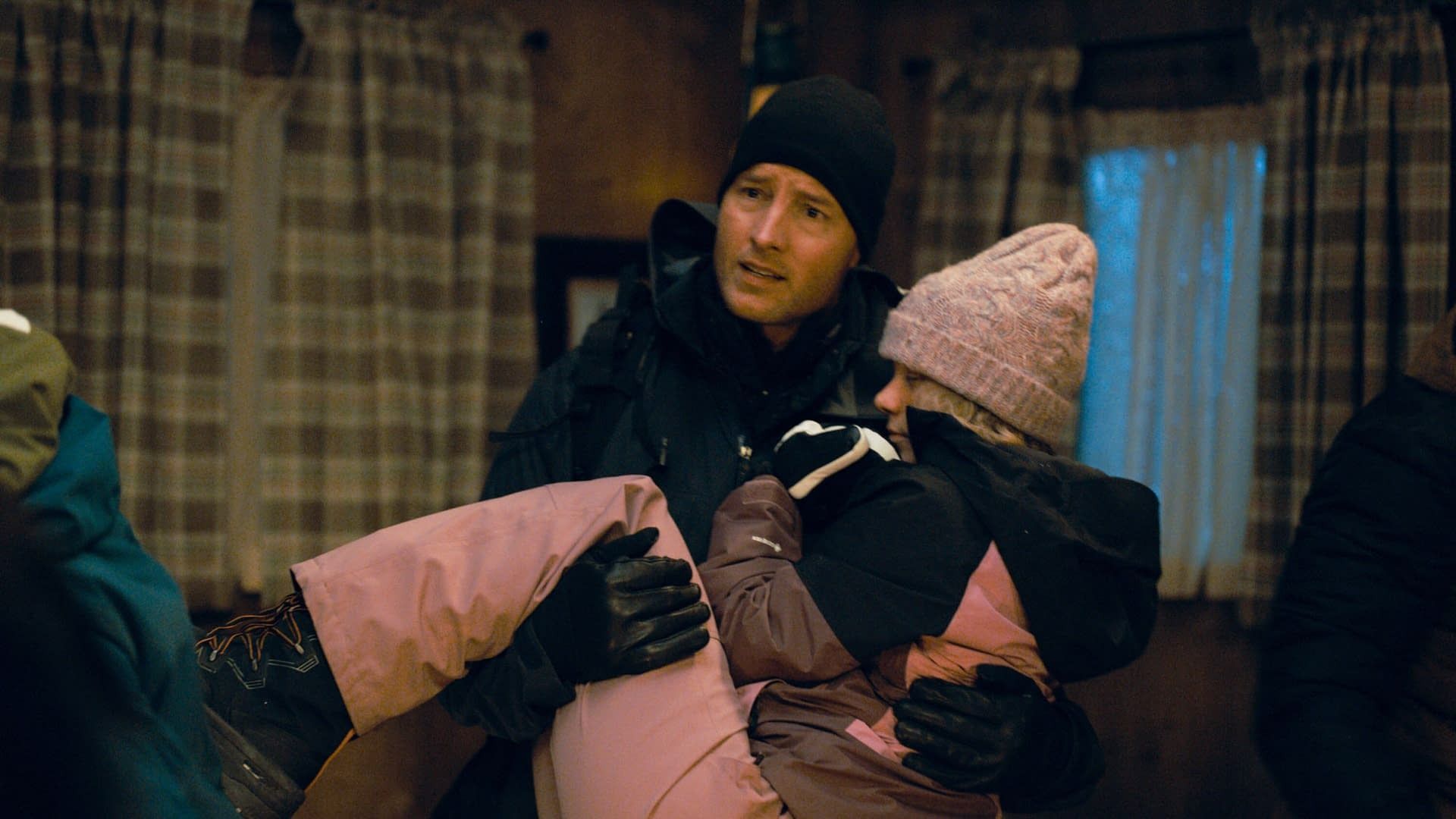 Colter holding an injured Shelly in his arms in Tracker