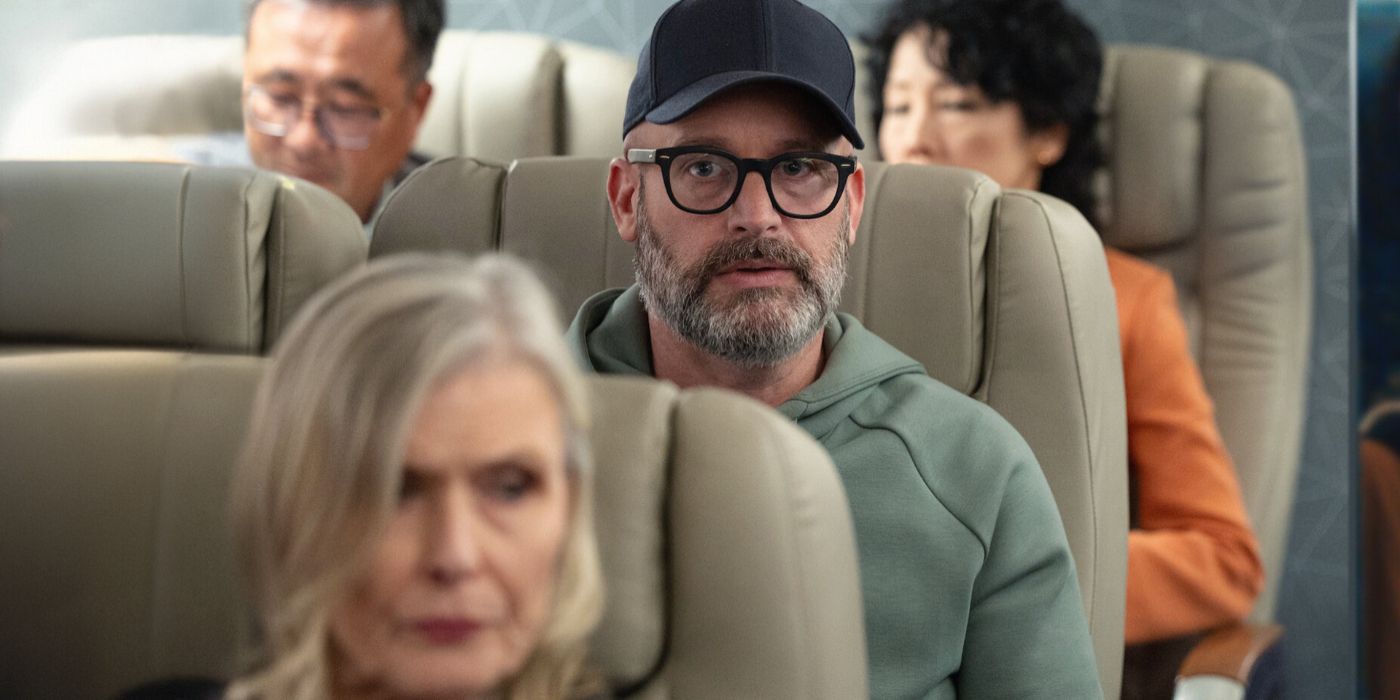 Tom Segura sits in a train in Bad Thoughts
