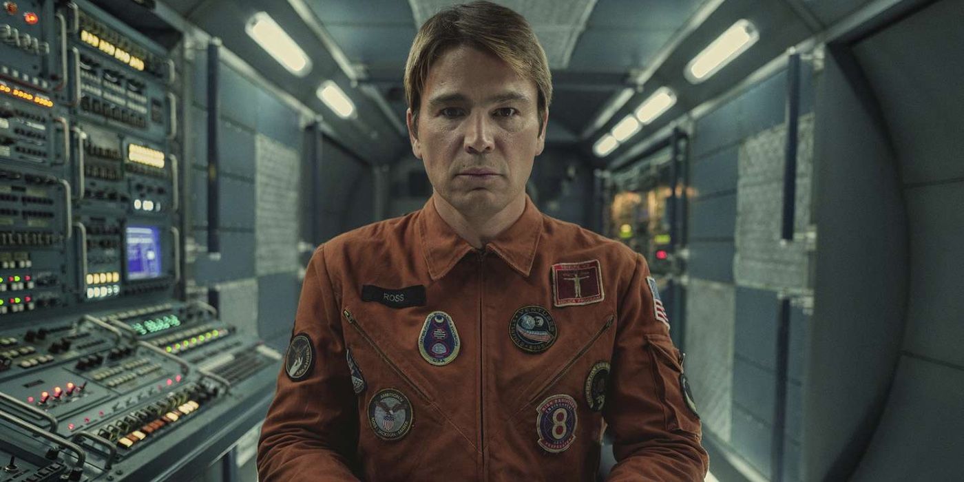 Josh Hartnett sits in an astronaut suit with a serious face in Black Mirror