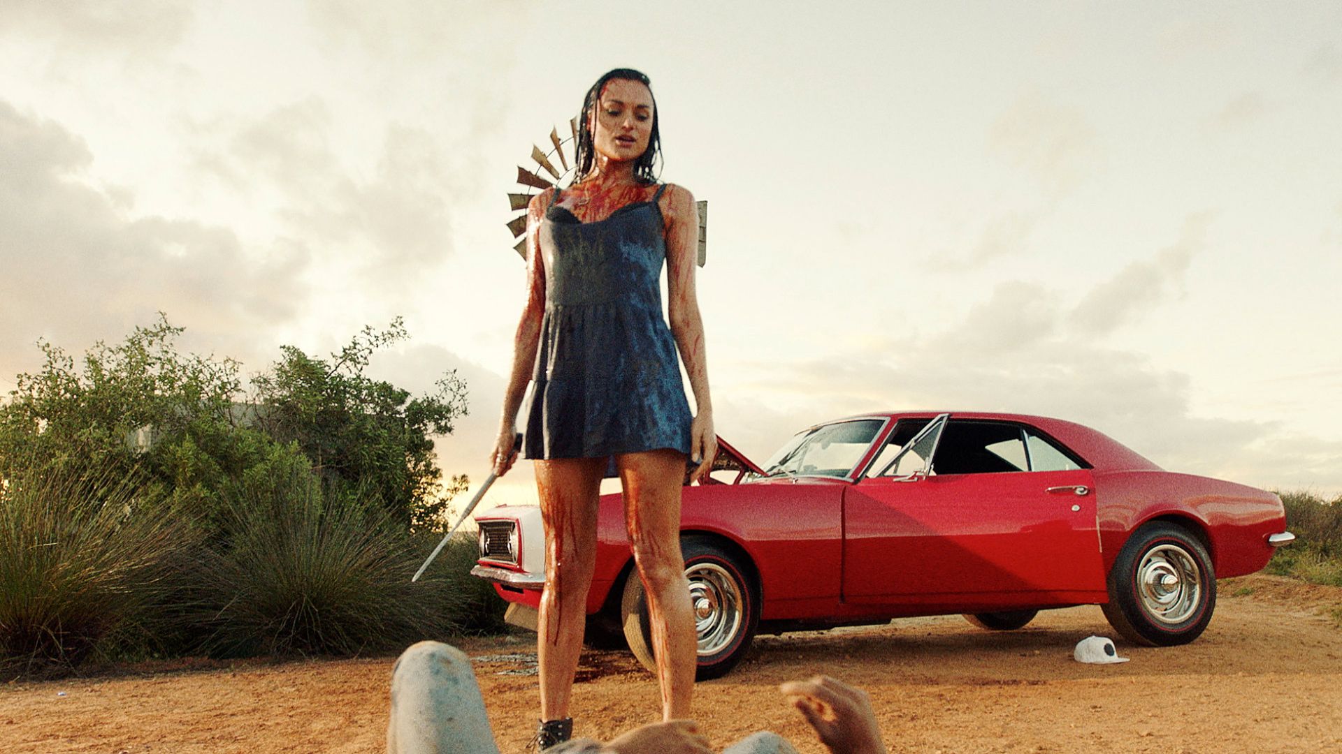 Grace stands over a victim with a blade in Blood Drive