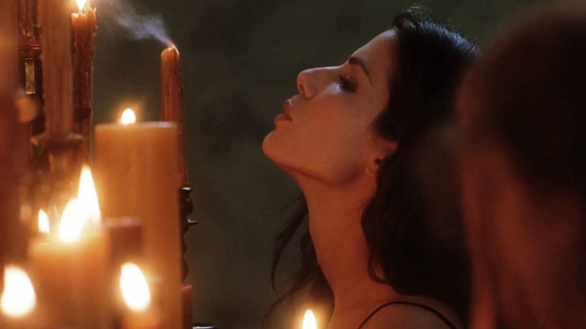 Sandra Bullock blows out a candle in Practical Magic