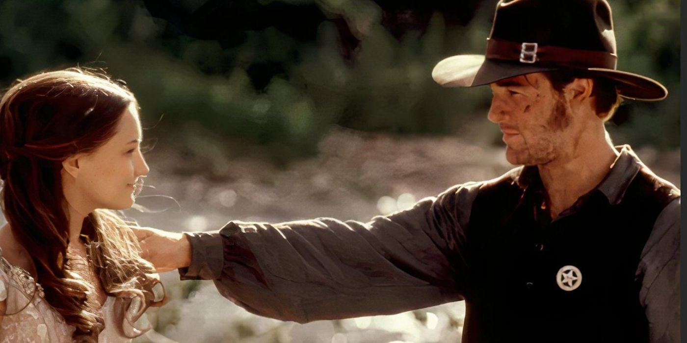 A man touching a woman's shoulder in Texas Rangers.