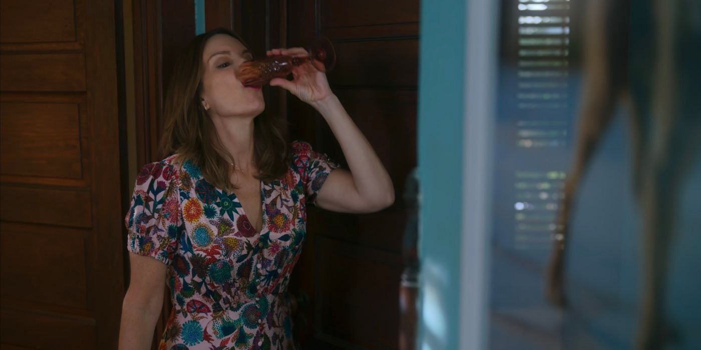 Kate taking a drink in episode 2 of The Four Seasons.