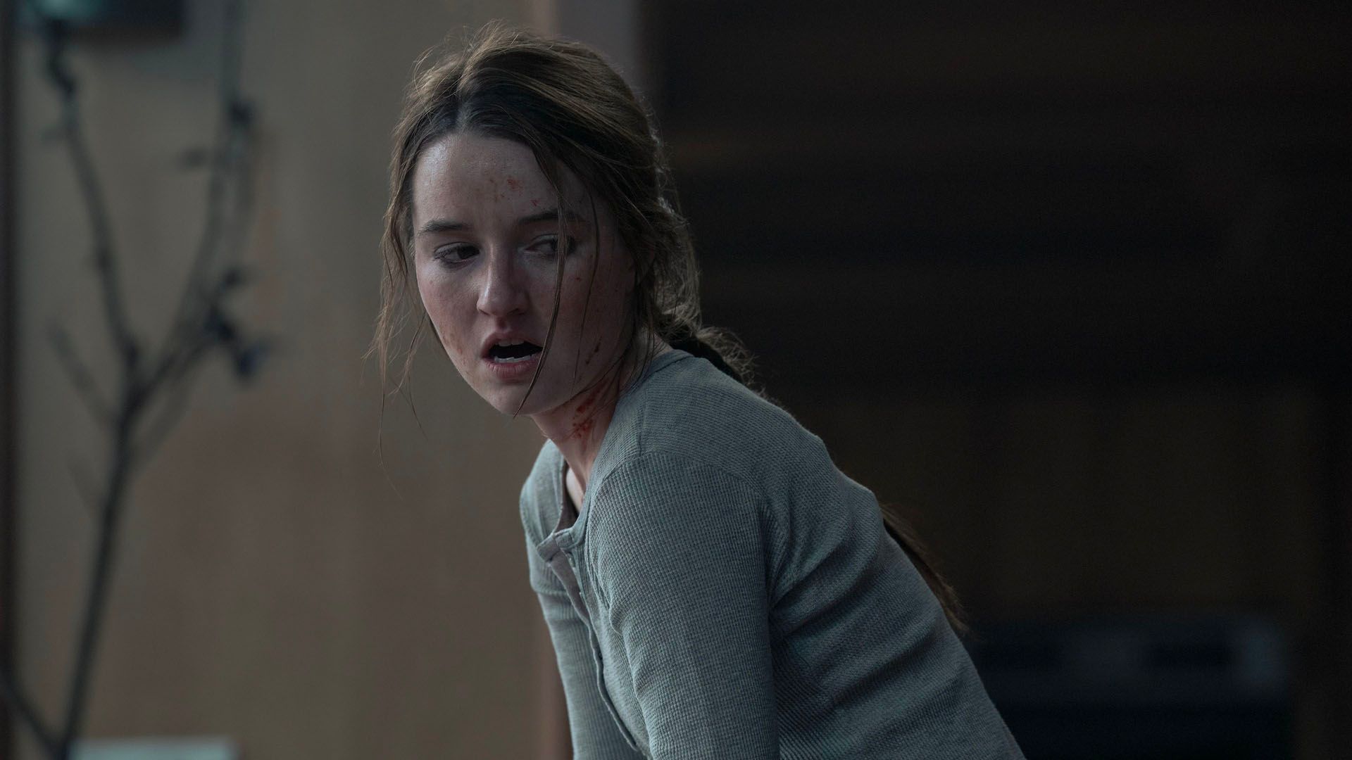 Abby with a bloody face looking angry in The Last of Us