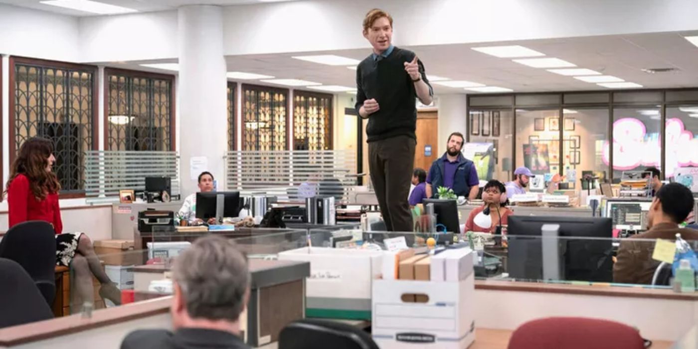 A man stands on a desk in The Paper