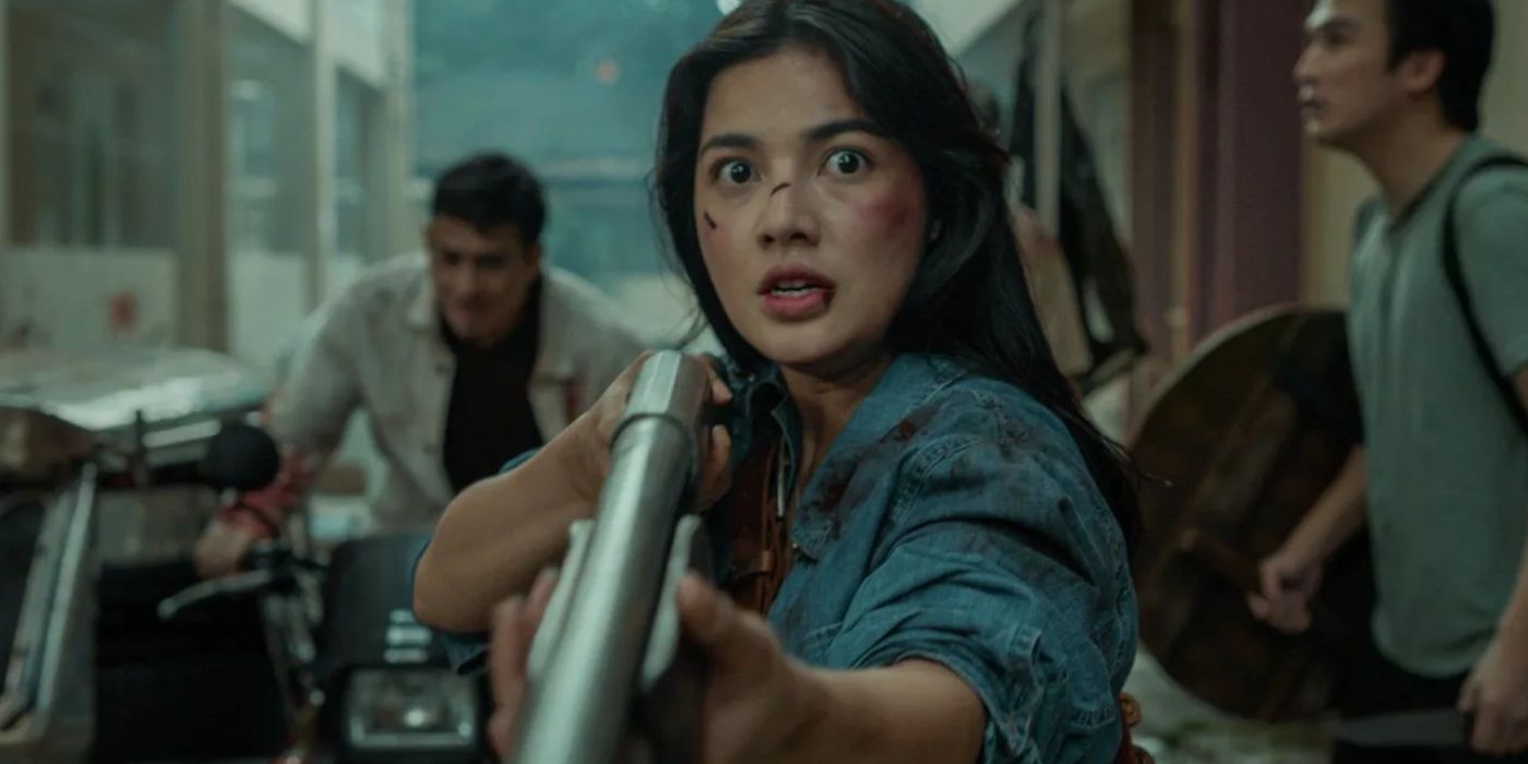 A frightened woman holds a gun in Shake, Rattle & Roll Extreme
