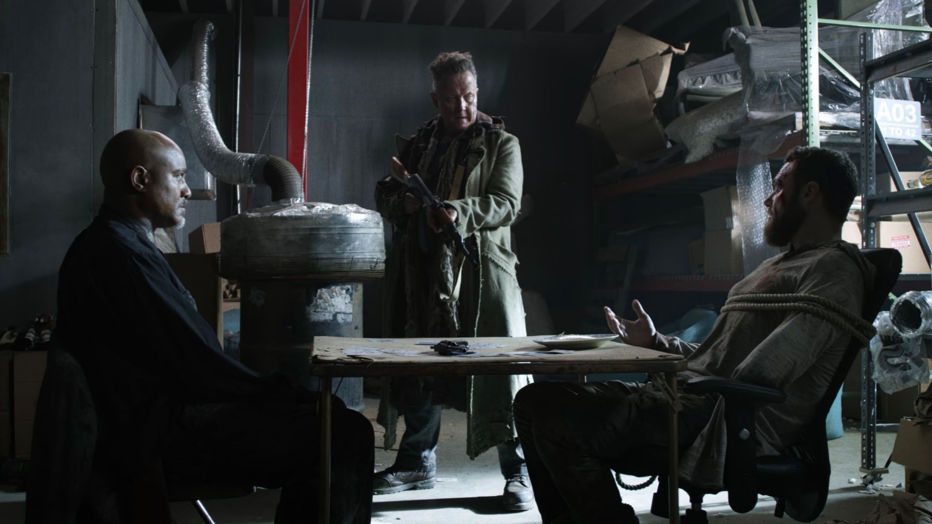 Aaron and Gabriel are forced to play Russian Roulette by Mays in The Walking Dead episode One More.