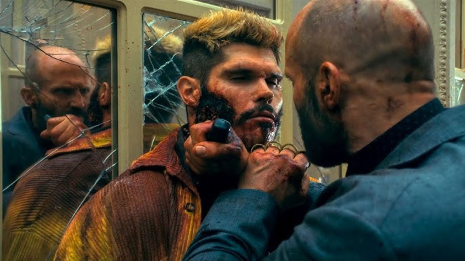 Adam stabs a man in the neck in The Beekeeper