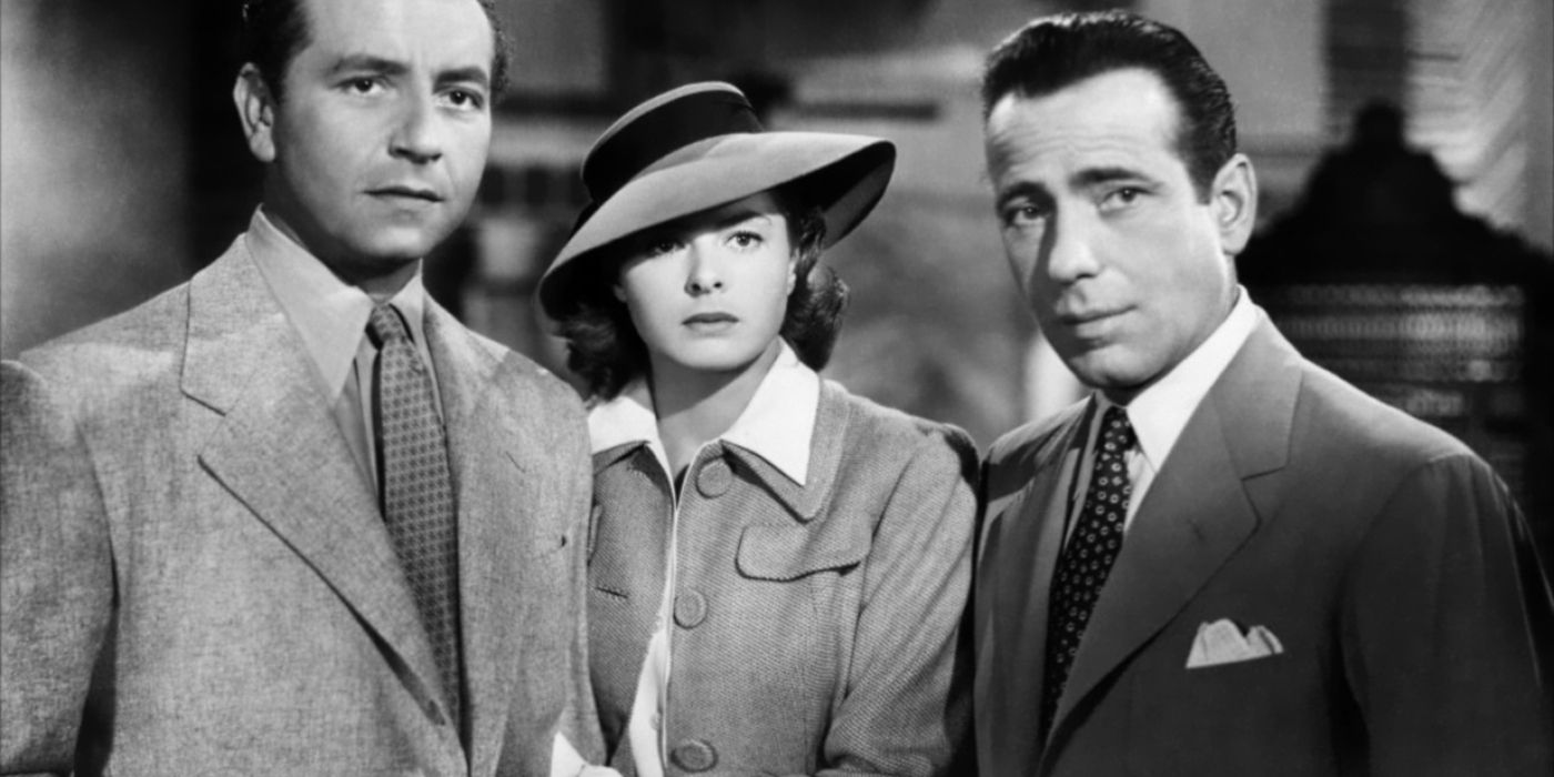 Victor, Ilsa, and Rick standing in a row in Casablanca.