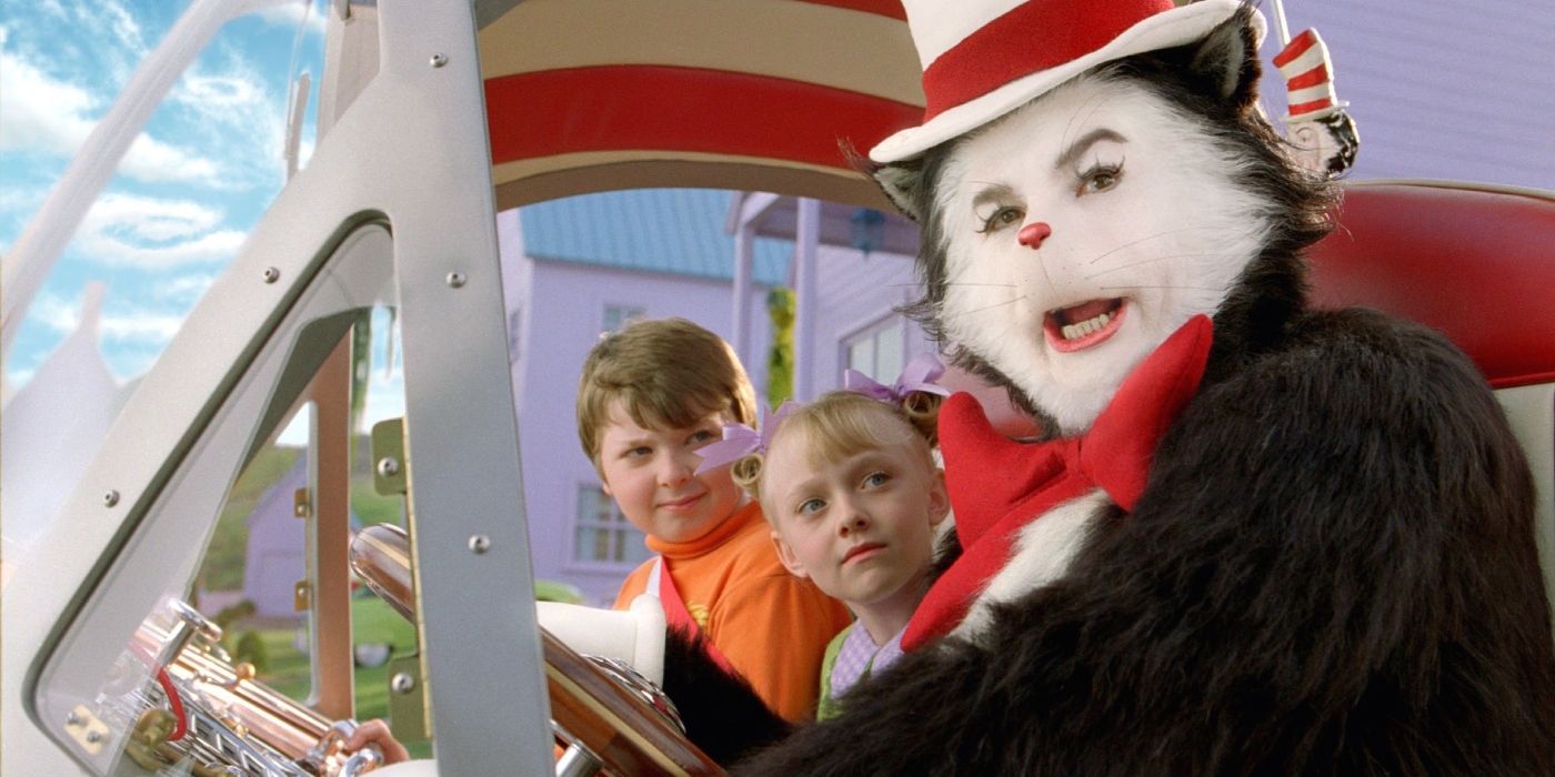 Two children and Cat in the Hat sitting in a car.