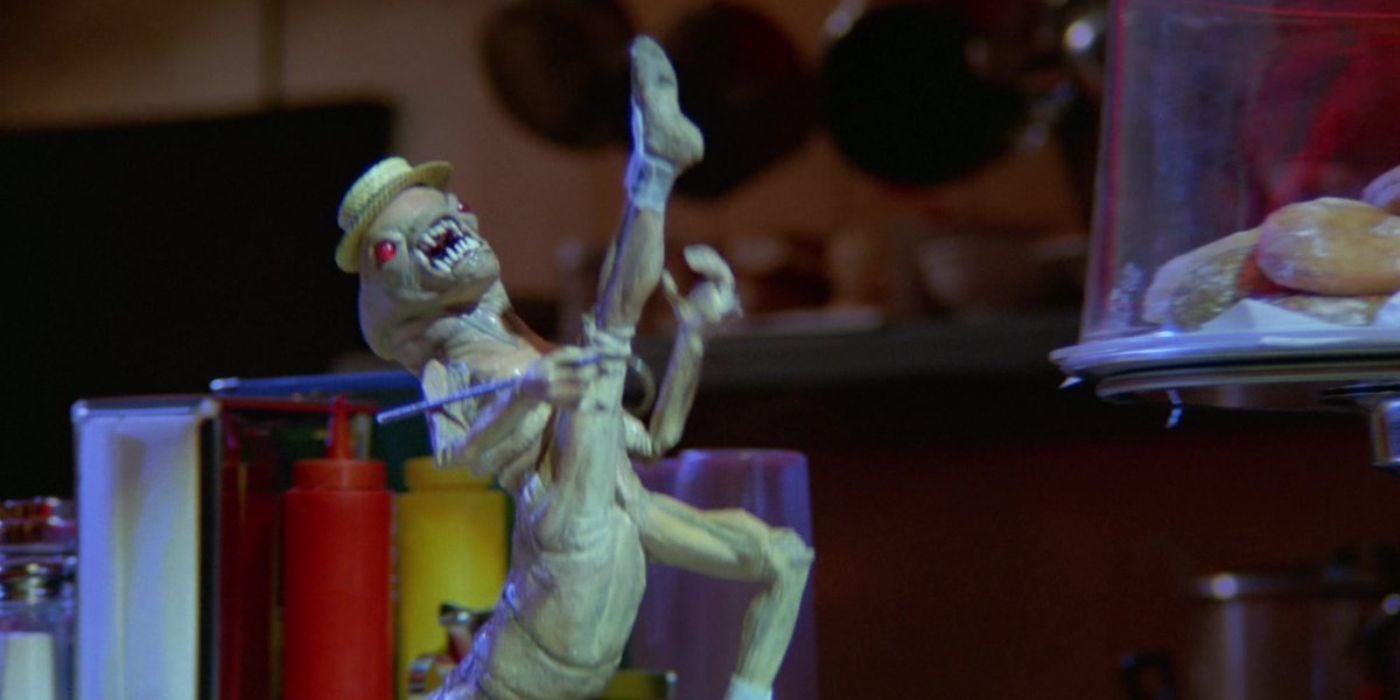 An alien dances like Michigan J. Frog in Spaceballs