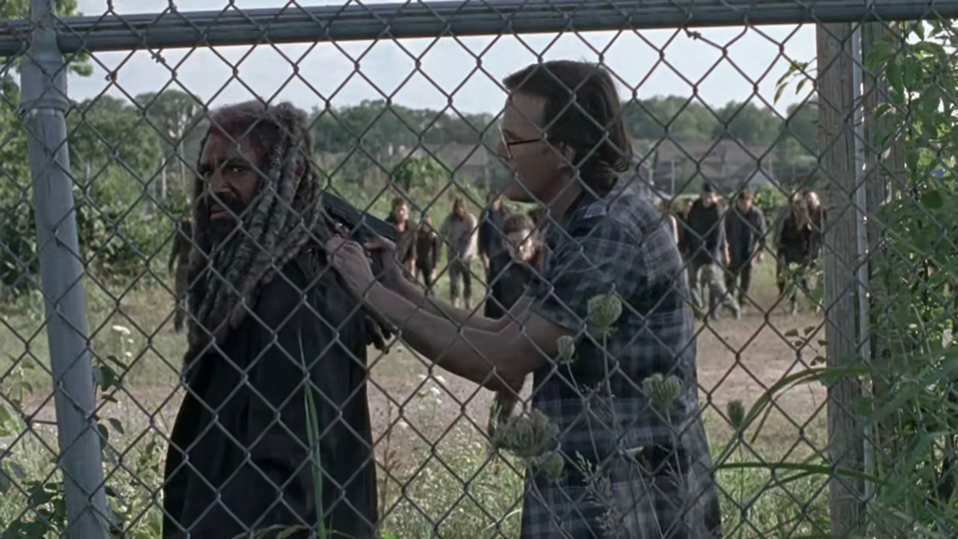 Gunther threatens Ezekiel with a gun in Some Guy, an episode from The Walking Dead.
