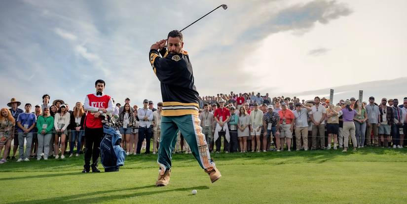 Happy on the golf course swinging in a Boston Bruins jersey in Happy Gilmore 2