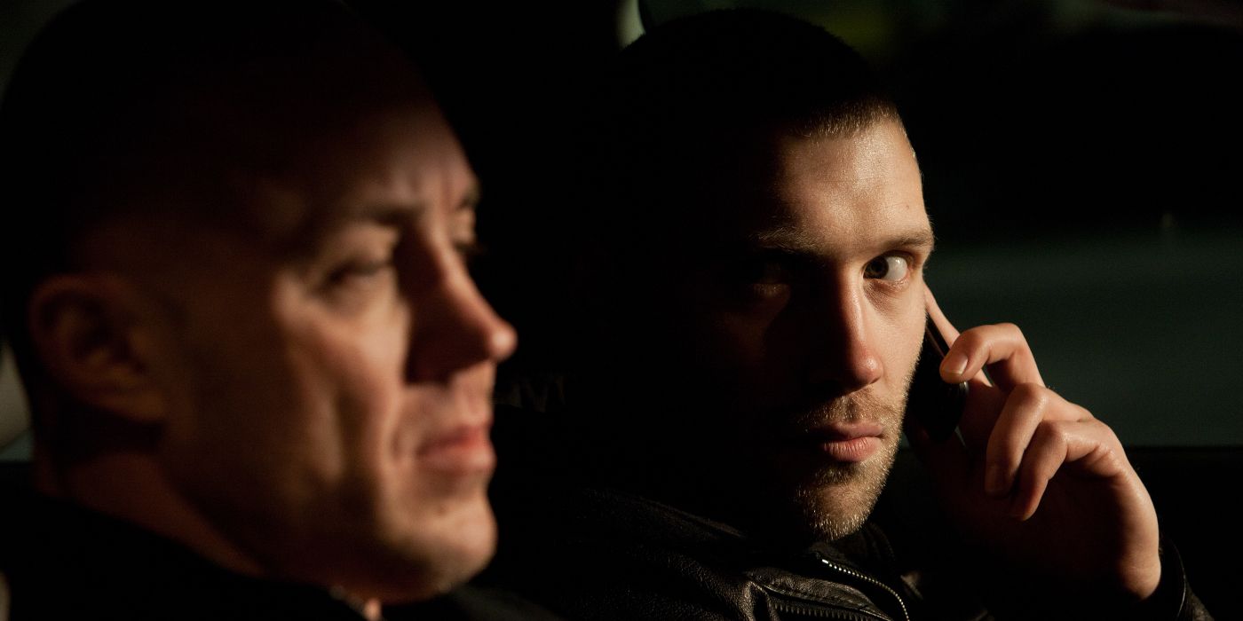 Jai Courtney talking on the phone in Jack Reacher 