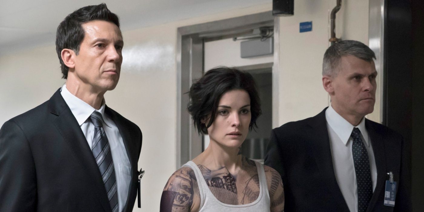 Jane gets escorted by agents in Season 1 of Blindspot