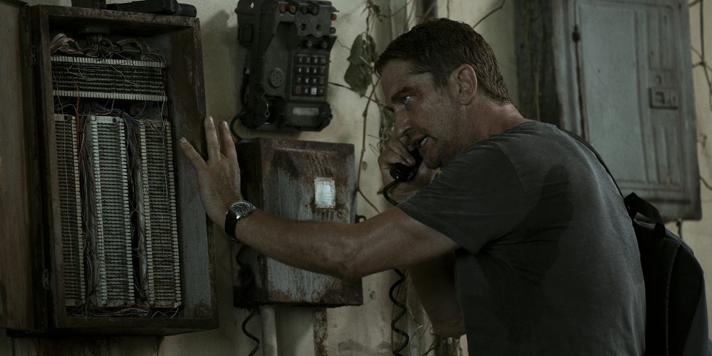 Gerard Butler in Plane talking on a phone