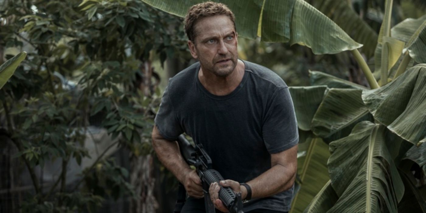 Gerard Butler in Plane holding a rifle in the jungle