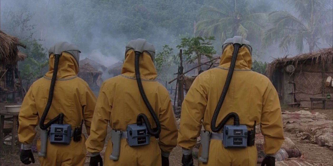 scientists in hazmat suits arrive at a village in the film outbreak