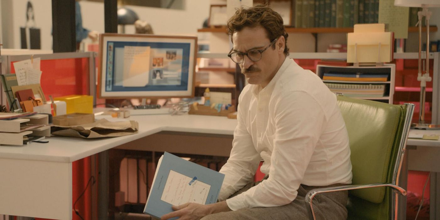 Joaquin Phoenix as Theodore in Her in a cubicle