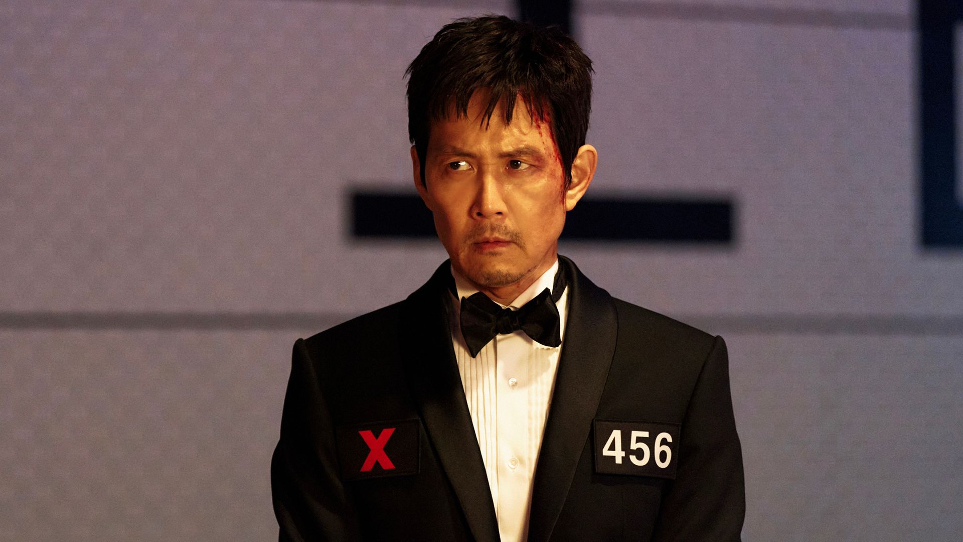 Gi Hun wearing a suit in Squid Game