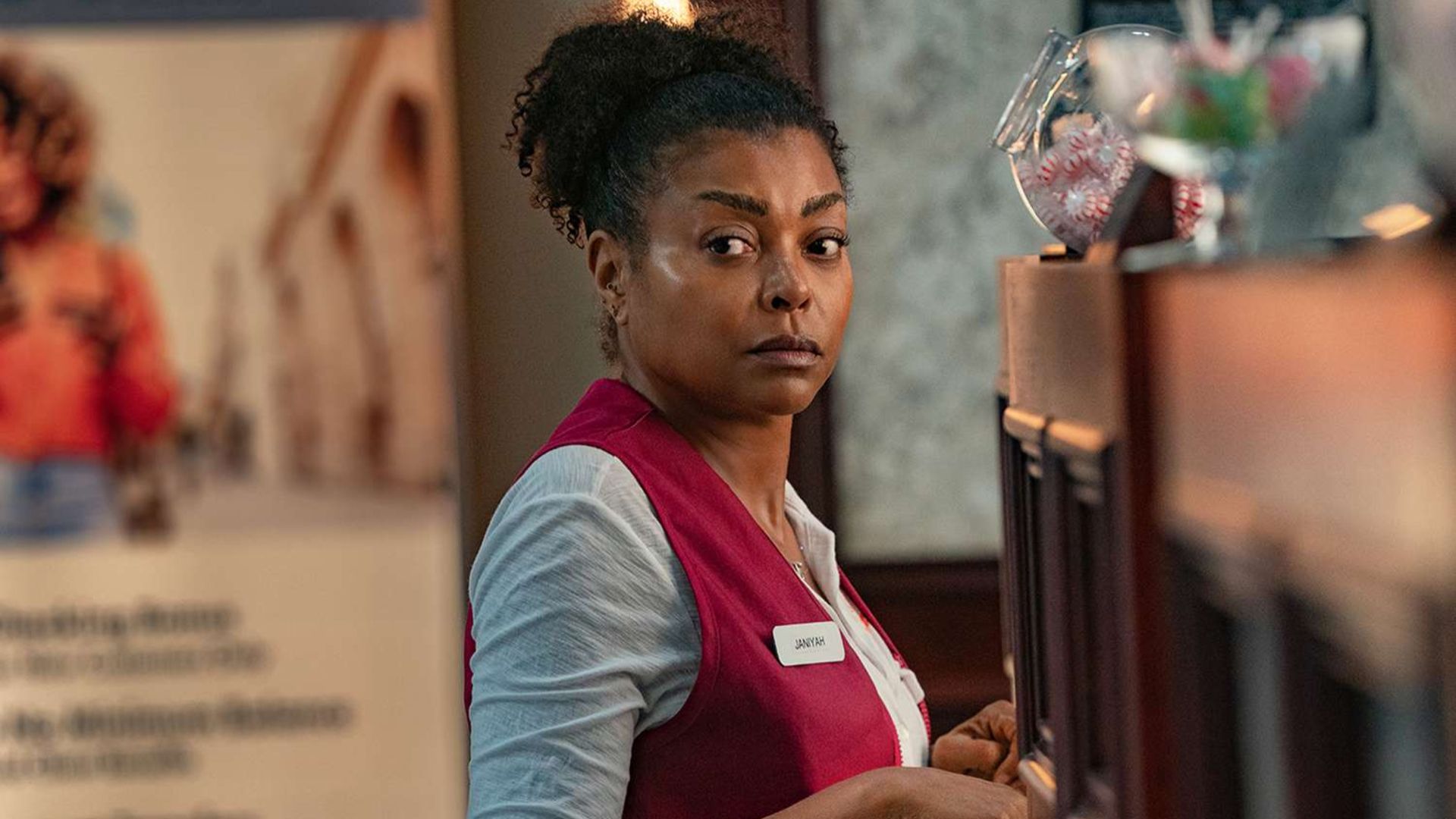 Janiyah stands at a work counter in Straw