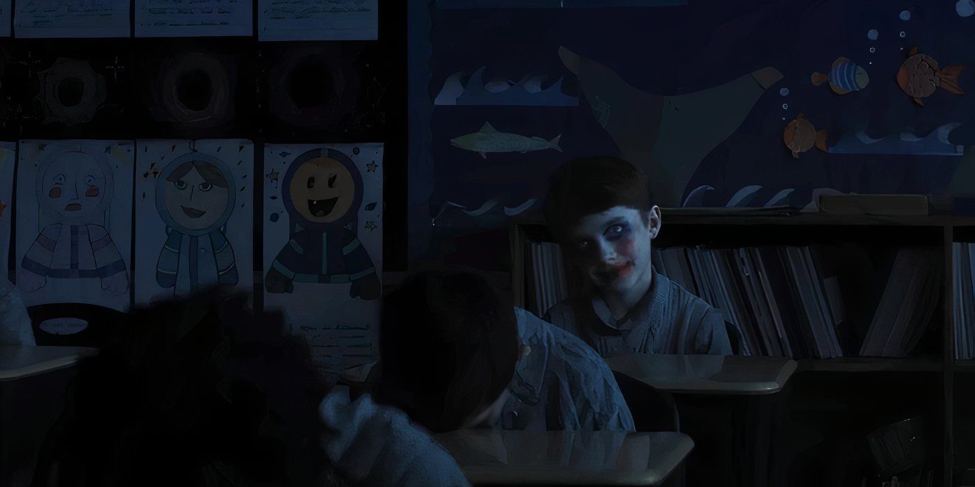 A still of a creepy kid smiling with paint on his face from the new trailer for Zach Cregger's horror film 'Weapons'.