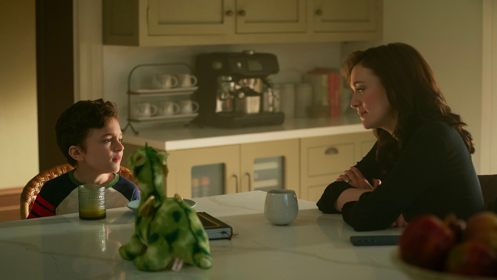 Henry and Kate sitting at the table together in You.