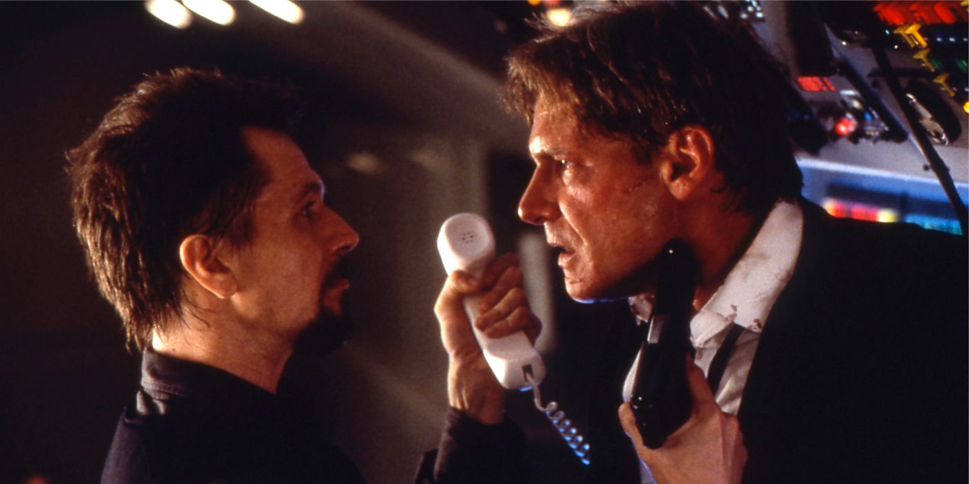 Egor holds a gun to Jame's neck in Air Force One