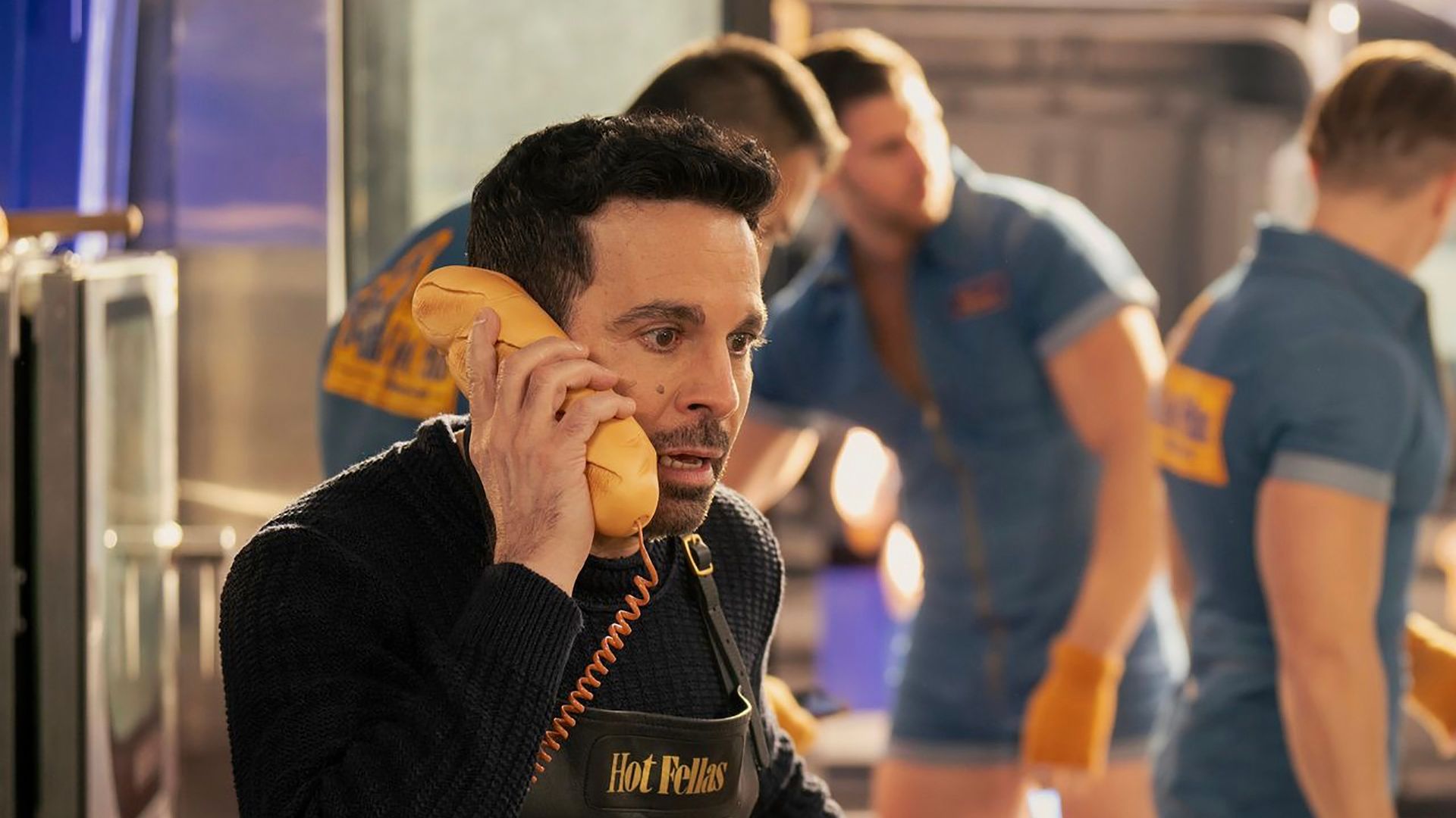 Anthony talking on the phone in his bakery in And Just Like That...