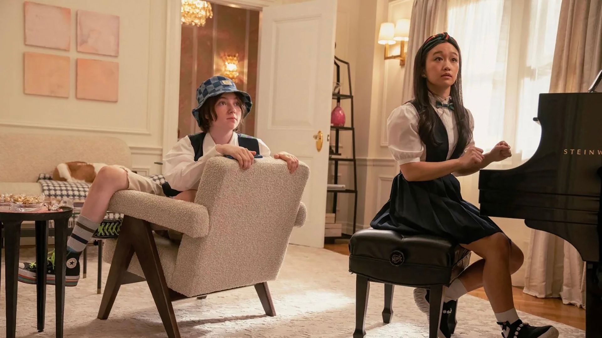 Rock sitting in a chair, Lily at the piano in And Just Like That...