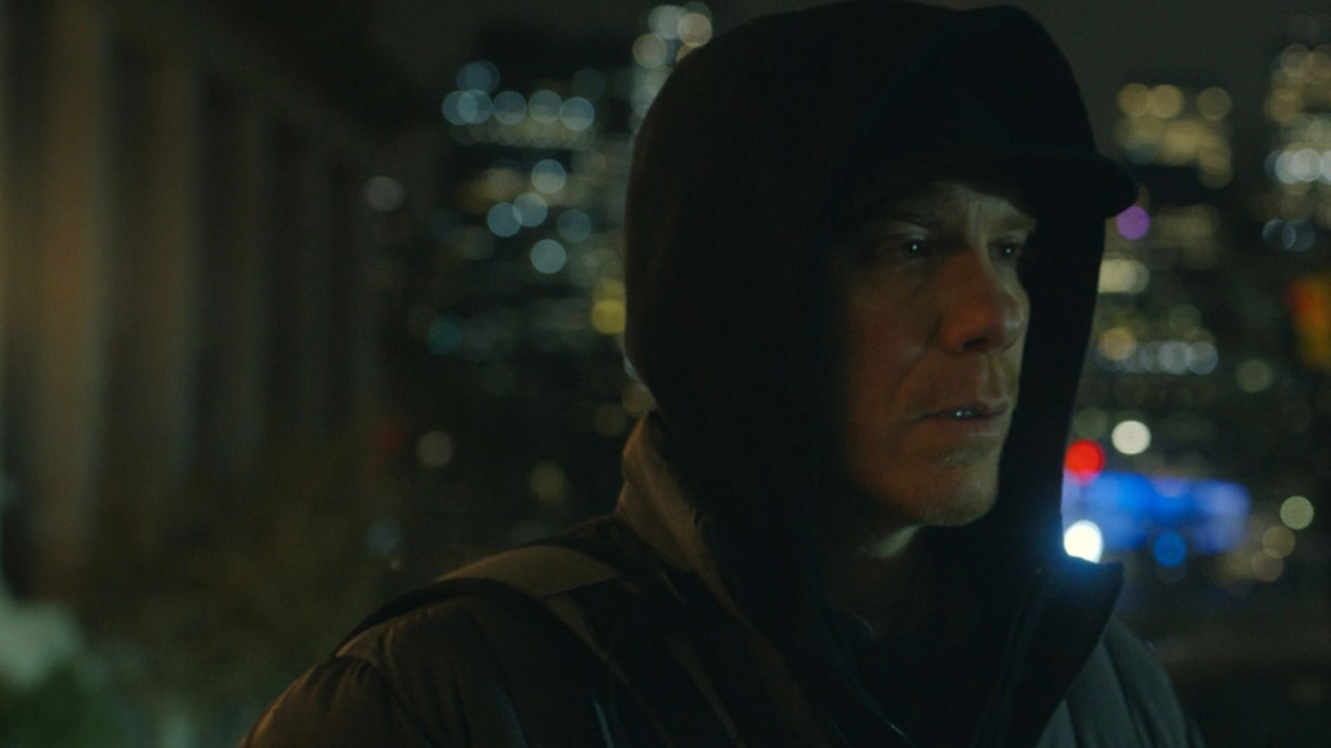 The Dark Passenger killer in the street wearing a hoodie in Dexter: Resurrection.