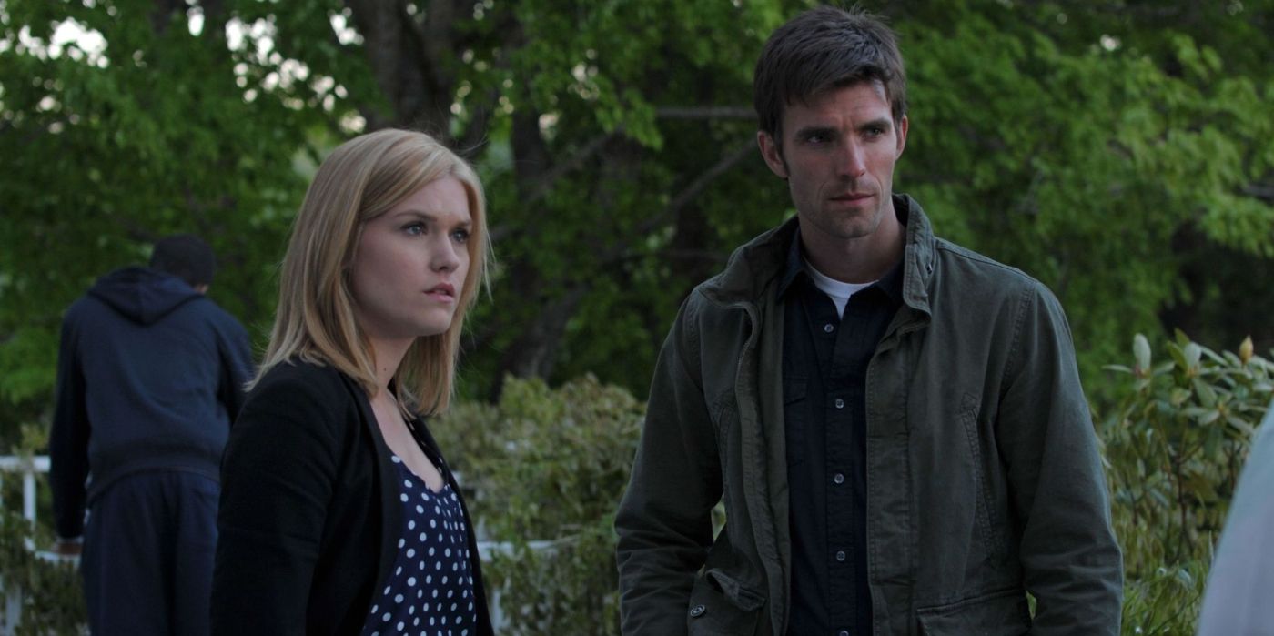 Audrey and Nathan stand by trees in Haven
