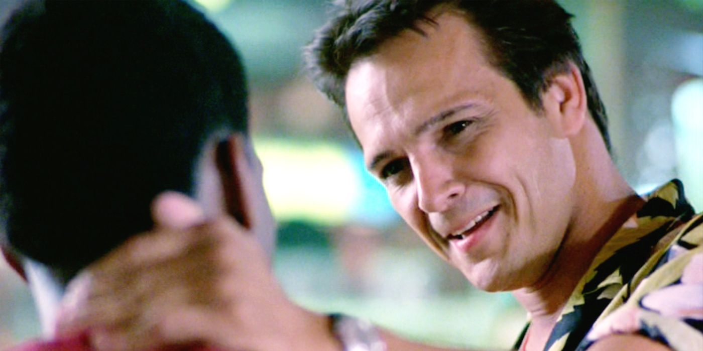 Mikey touches Axel's shoulder in Beverly Hills Cop