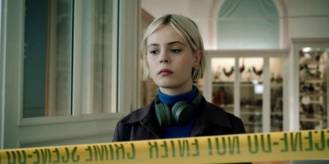 Patience standing in front of caution tape in Patience