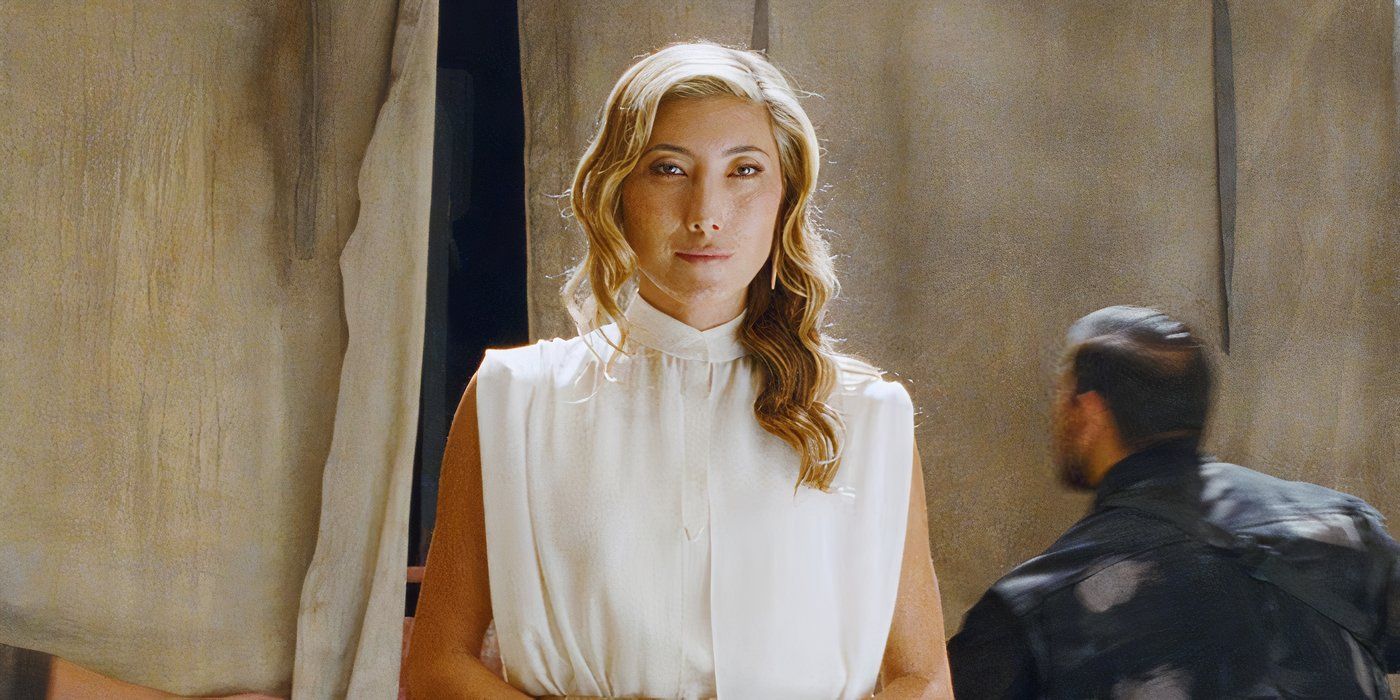 Soyona Santos is a dinosaur smuggler, wearing a white dress.