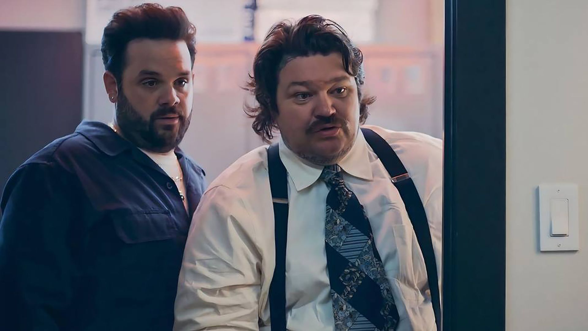 Teddy and Neil Fak talking to someone from a doorway in The Bear.