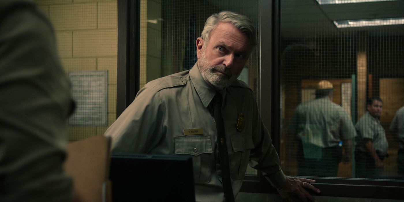 Paul stands by a police cage in Untamed