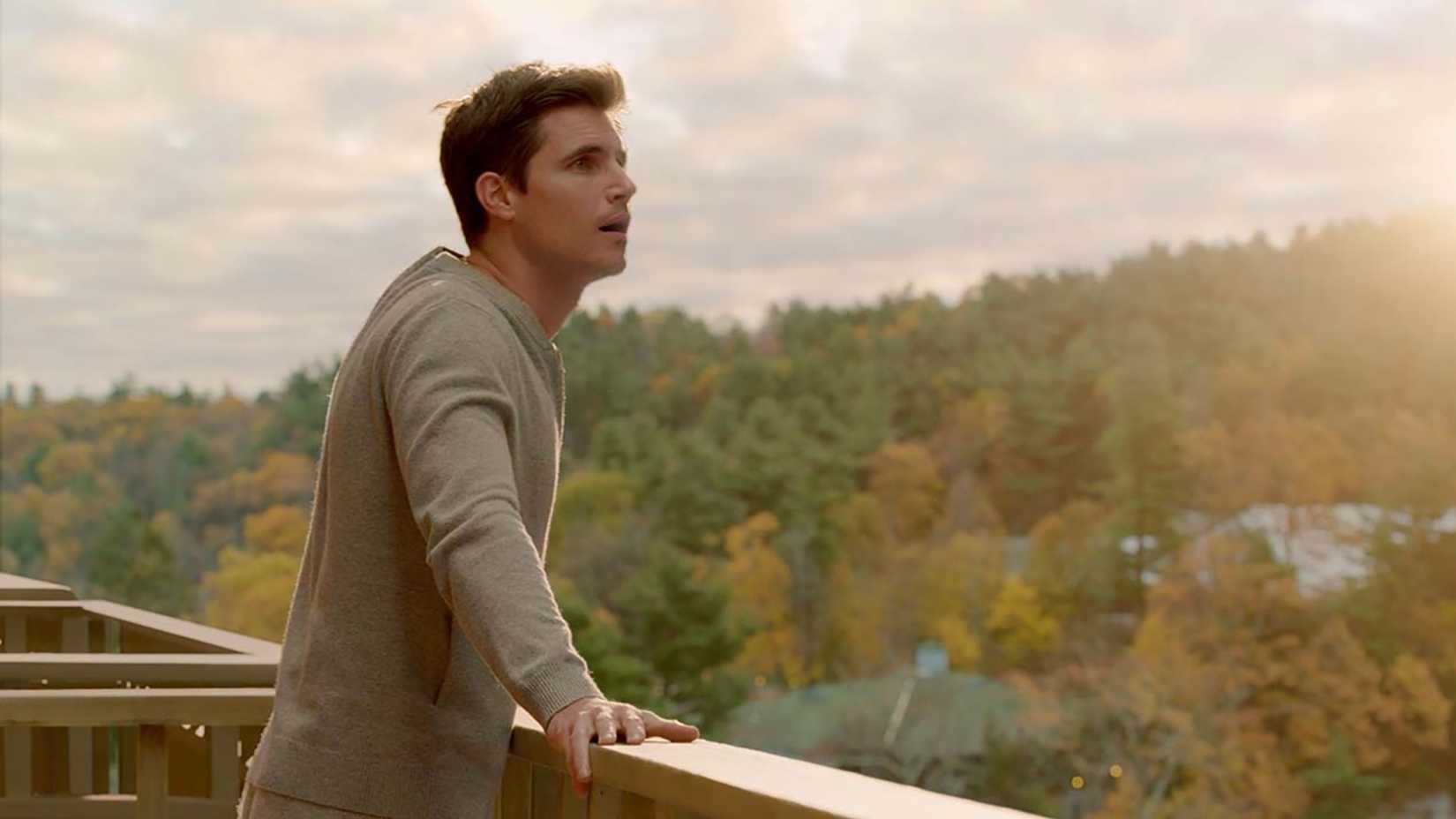 Nathan at Lakeview staring out into the skies in Upload.