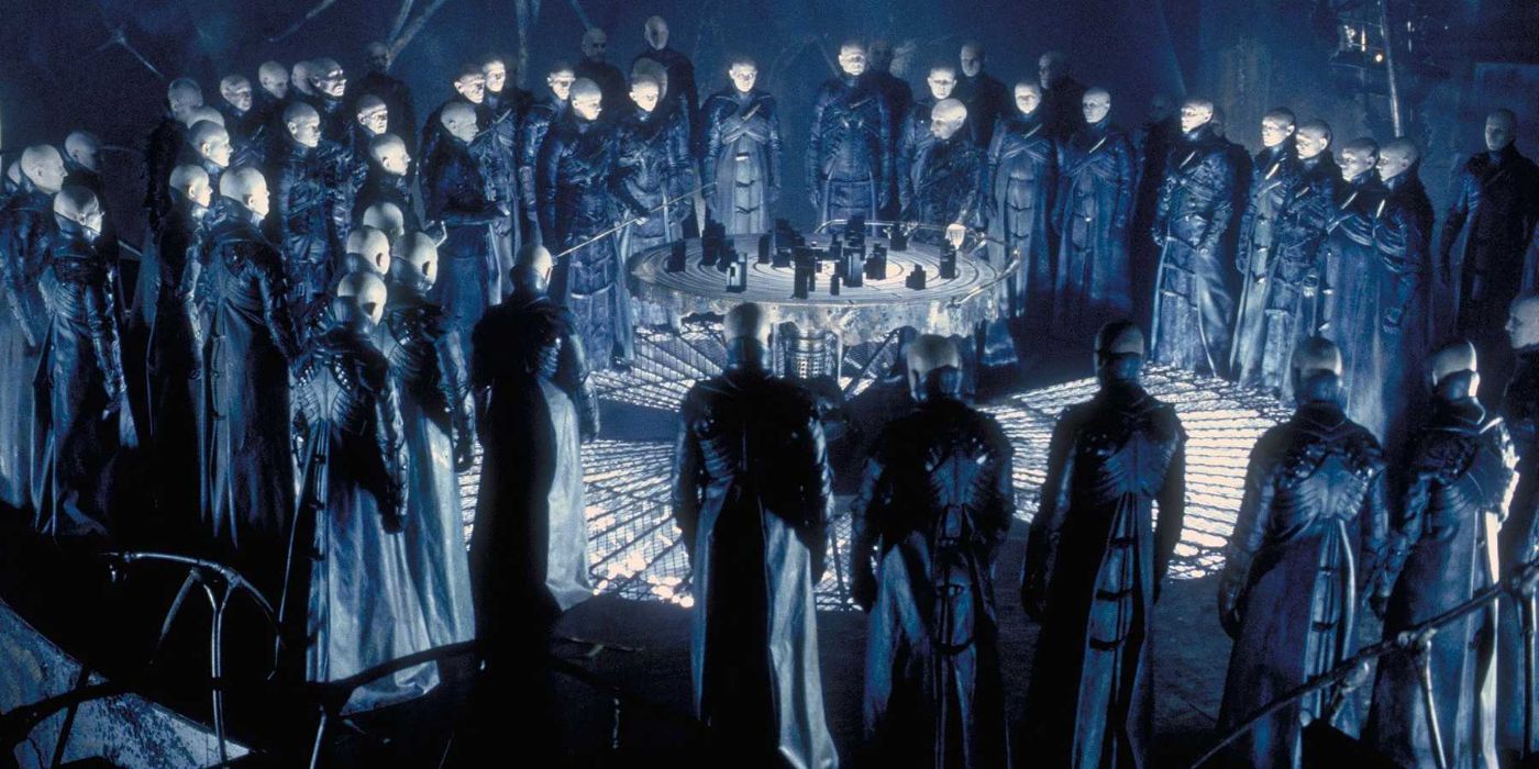 The Strangers gather in a circle in Dark City