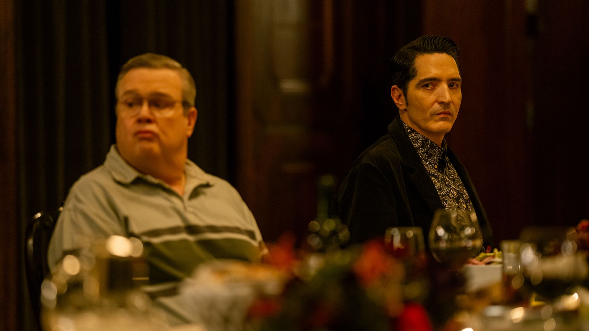Al and Gareth at the table during Leon's dinner party in Dexter: Resurrection.