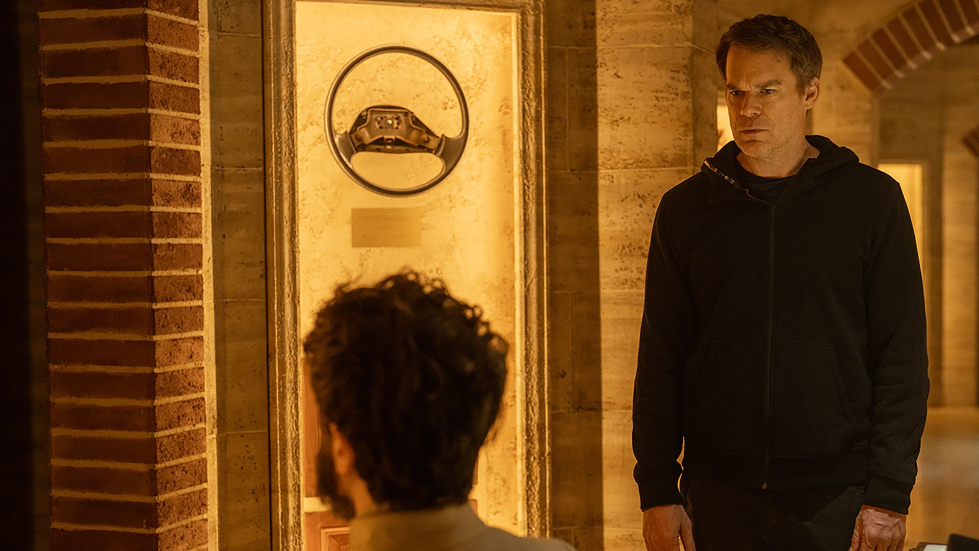 Leon showing Dexter items in his museum in Dexter: Resurrection