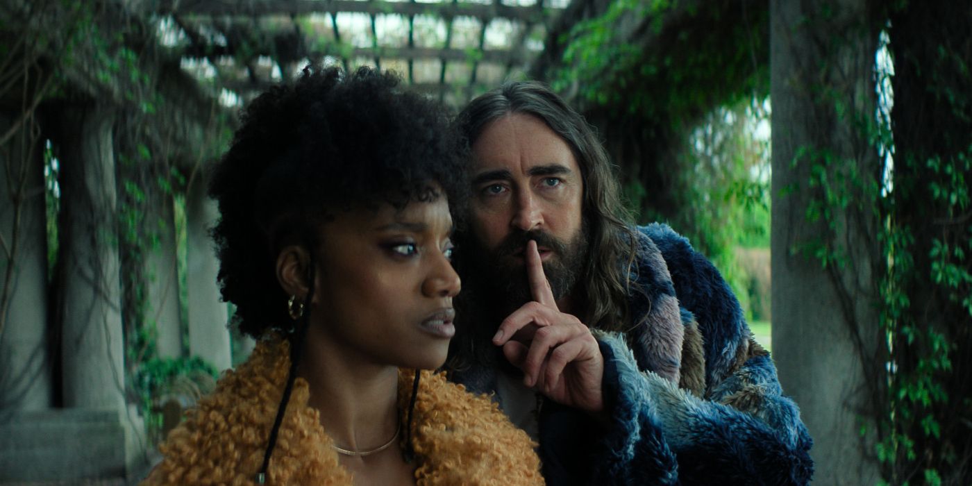 Lee Pace as Brother Day whispering a secret to Yootha Wong-Loi-Sing as Song in Foundation Season 3.