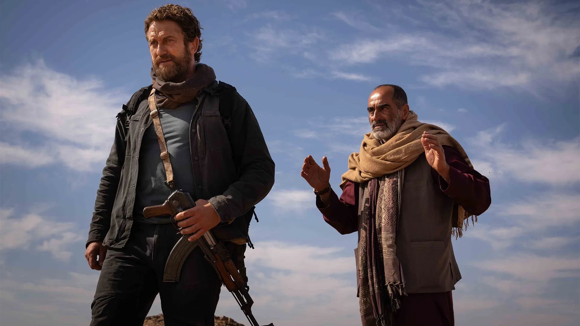 Gerard Butler as Tom Harris and Navid Negahban as Mohammad 