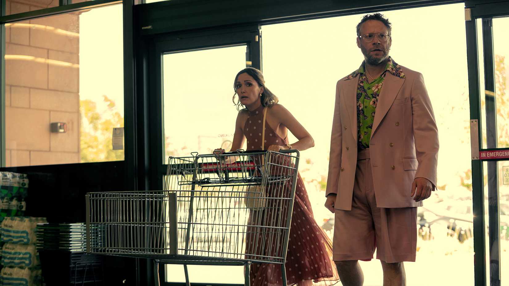 Sylvia and Will in a liquor store with a shopping cart in Platonic.