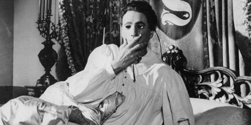 Guy Rolfe in Mr. Sardonicus (1961) leaning up in bed