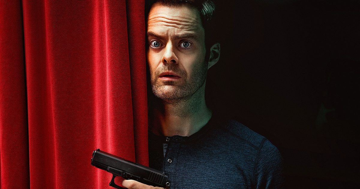 Bill Hader holding a gun with a theater curtain halfway against him in Barry