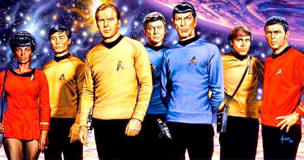 The main characters of Star Trek The Original Series stand next to each other on a planet