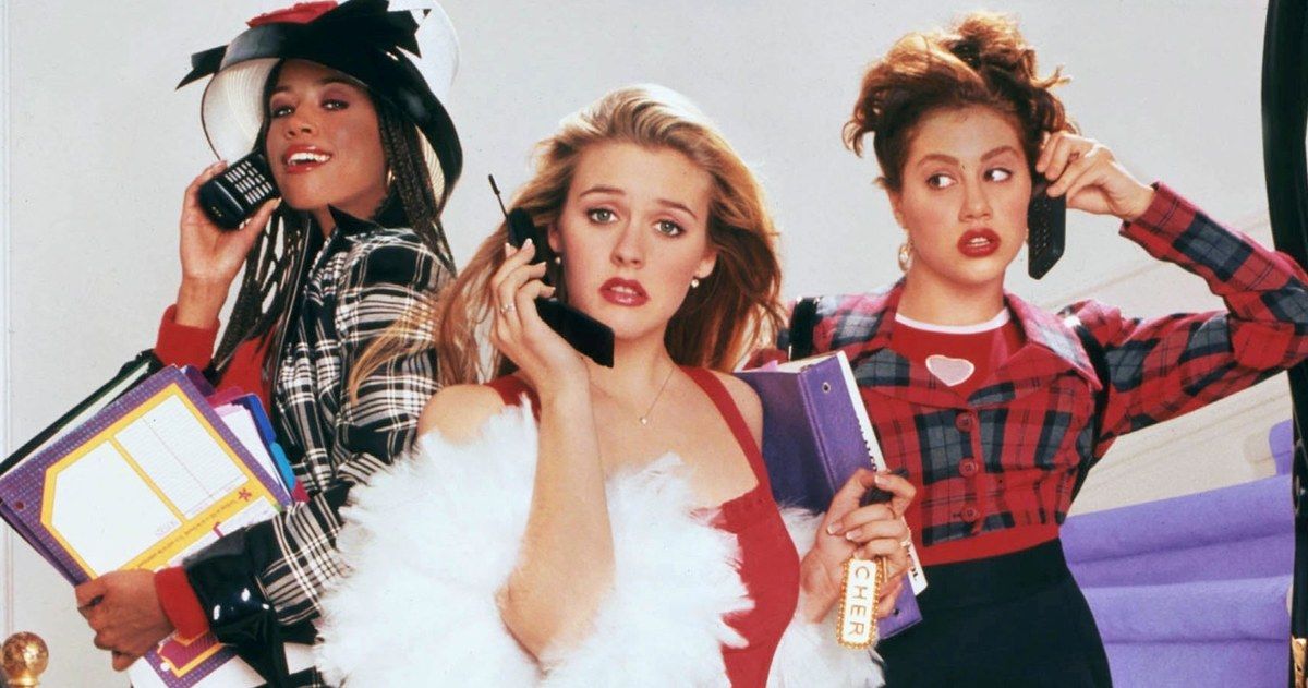 The cast of Clueless in their great outfits and on their 90s mobile phones