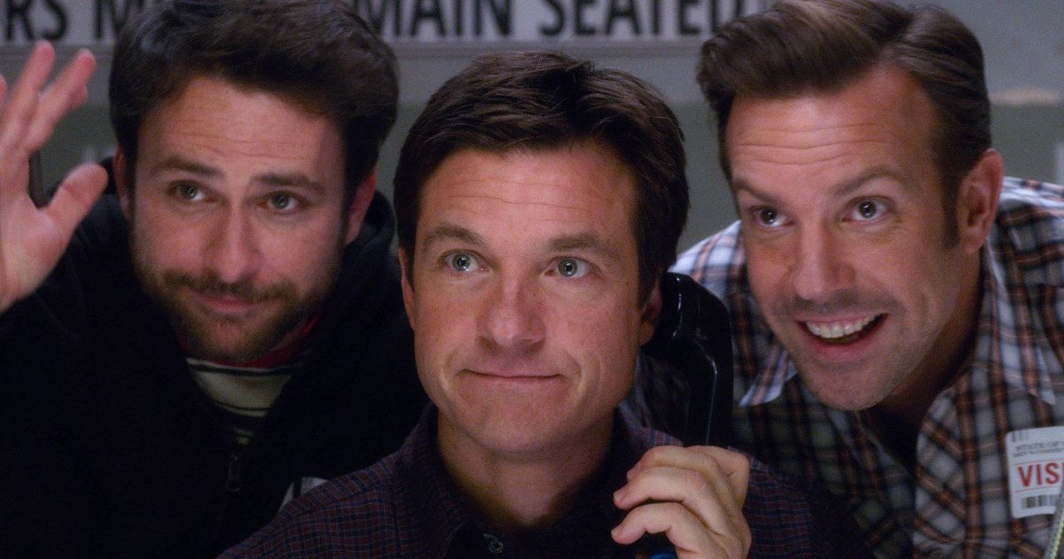 Jason Bateman on the phone in the center of Charlie Day and Jason Sudeikis