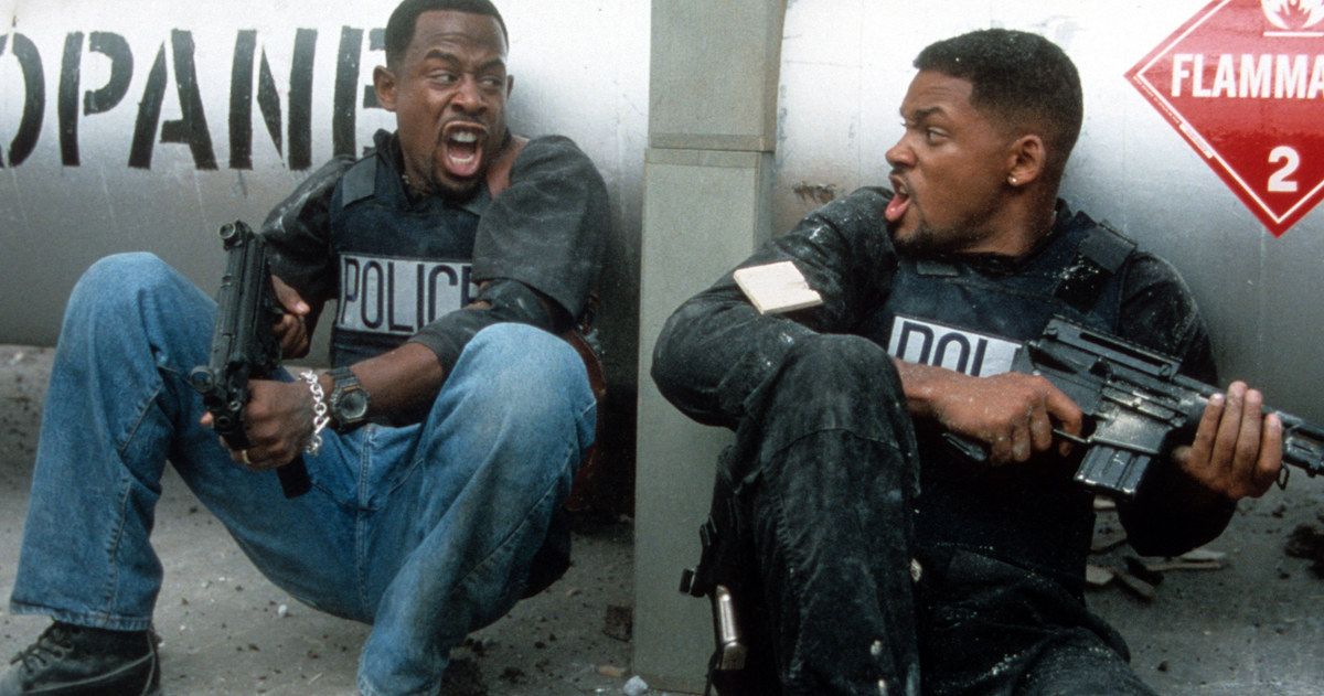Will Smith and Martin Lawrence huddle together in Bad Boys